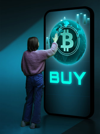 Person interacting with giant smartphone displaying bitcoin and buy buttonの写真素材