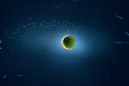 Floating tennis ball in space with light particles in abstract environmentの写真素材