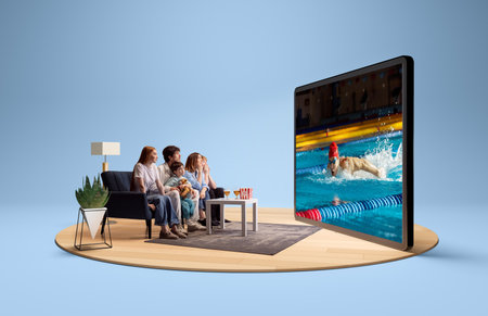 Family watching swimming competition on large screen in modern living room. 3D island compositionの写真素材