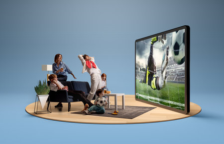Family watching goalkeeper save during soccer match on big screen at home in 3D island compositionの写真素材