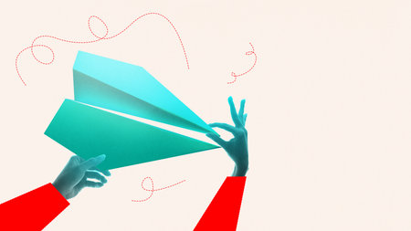 Digital collage. Hands launching a turquoise paper plane in motionの写真素材