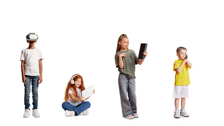 Children using digital devices and virtual reality headset isolated on white backgroundの写真素材