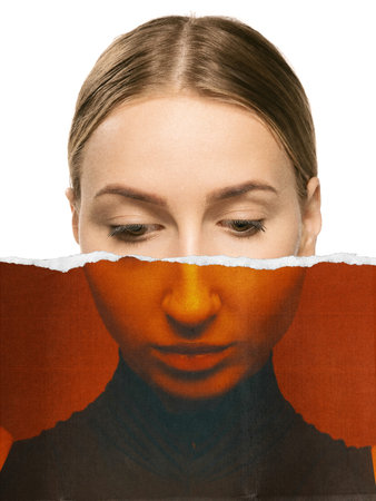 Dual-tone collage portrait of woman with lowered gaze and introspective emotionの写真素材