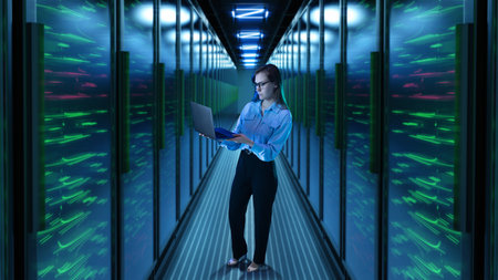 Woman with laptop standing in glowing 3D server corridor