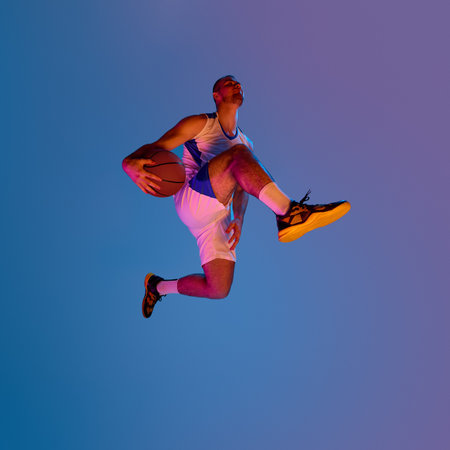Basketball player mid-air dunking on vibrant gradient background