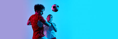 Soccer players contesting ball in air under vivid pink and blue gradient lighting. Banner