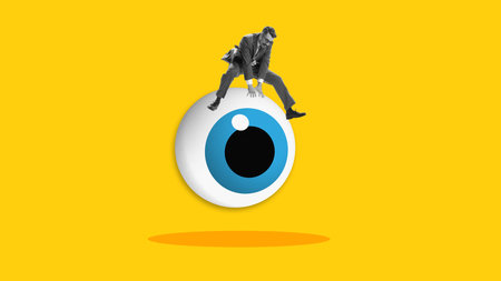 Graphic composition. Businessman sitting on giant blue eyeball on yellow backgroundの写真素材