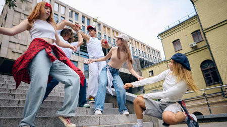 Street dancers performing coordinated moves with intensity and passion outdoors