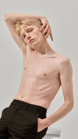 Shirtless man posing with artistic body gesture skincare styleの写真素材