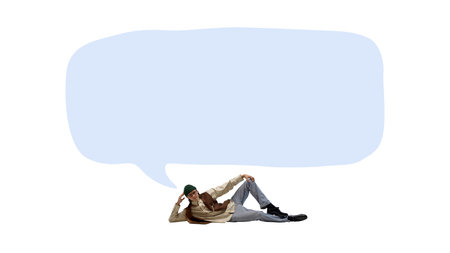 Creative digital artwork. Young man inside blue speech bubble with relaxed pose and copy space for text or messageの写真素材