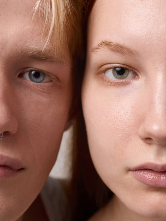 Macro portrait of young couple half faces focusing on skin texture and eyes