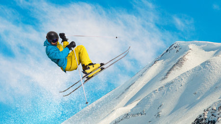 Skier executing freestyle trick sideways on snowy mountain slope. Hand made collageの写真素材