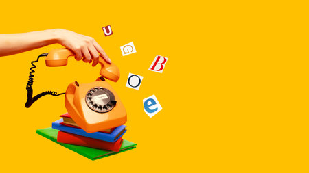 Modern collage of orange rotary phone on books with flying letters on yellow backgroundの写真素材