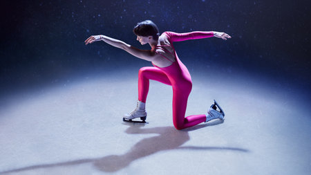Female ice skater in pink bodysuit kneeling forward with extended arms in artistic spotlight poseの写真素材