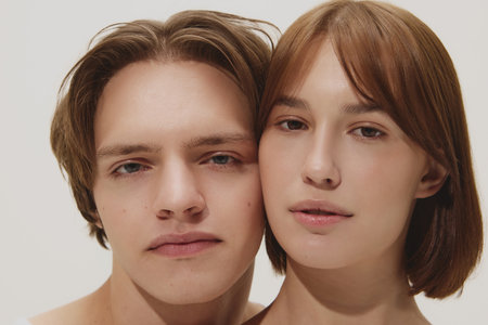 Minimal beauty close-up of couple with clean glowing skin and serenity