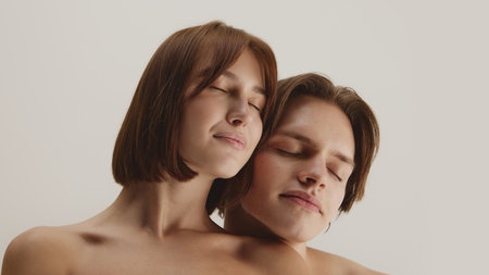 Couple with eyes closed leaning together in calm mindful relaxation
