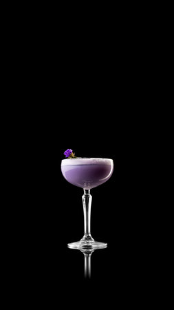 Minimal purple cocktail with flower garnish on reflective black surfaceの写真素材
