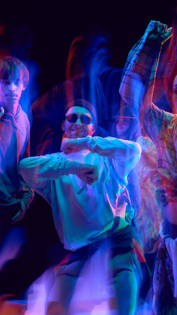 Urban hip hop crew dancing under colorful motion blur