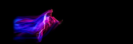 Basketball player kicking leg forward in dynamic motion blur. Bannerの写真素材