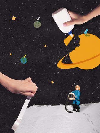 Child astronaut exploring handmade planets in creative space composition