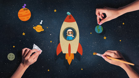 Digital artwork. Small rocket with child astronaut among paper planets and starsの写真素材