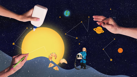 Hands building sun and constellations with crafting tools and small child astronaut helpの写真素材