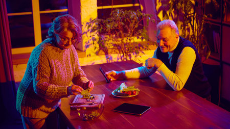 Two seniors at home managing daily tasks together with virtual assistant support
