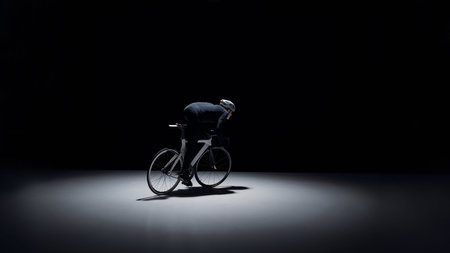 Cyclist from side view on road bike with large copy space for advertising.