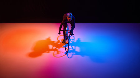 Professional cyclist maintaining focus during high intensity training ride.