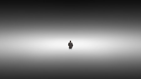 Surreal artwork man standing alone in endless fog space.の写真素材