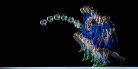 Stroboscopic soccer jump motion with ball trajectory on dark backgroundの写真素材