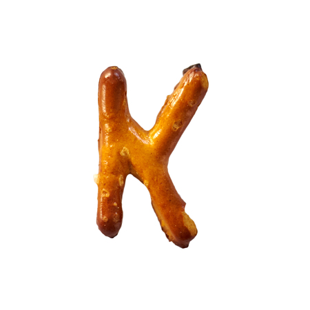 Pretzel Letter K Isolated On White Background Macro Shot Manually Detouredの写真素材