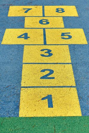 Hopscotch game in perspective in a schoolyard on an asphalt floorの写真素材