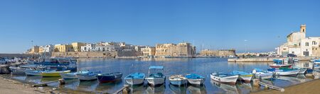 Typical Southern Italy Fishing Boats At Gallipoli Harbour Sit In Front Of Medieval Castle During a...