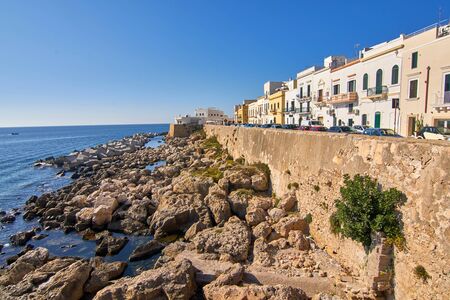 Coastline Cityscape With Colorful Houses During A Bright Atumn Day at Gallipoli Puglia Italyの写真素材