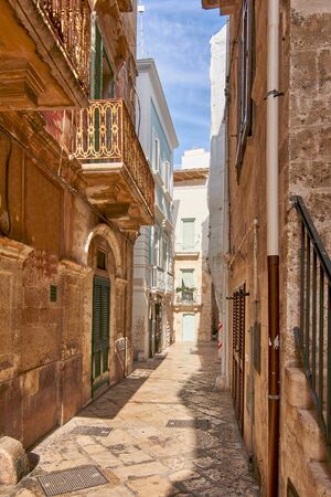 Typical Narrow Streets Of Medieval City Center In Polignano A Mare Apulia Italyの写真素材