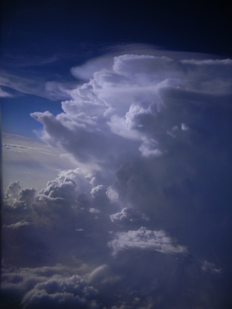 Dynamic formations of towering cumulus clouds high in the atmosphereの写真素材