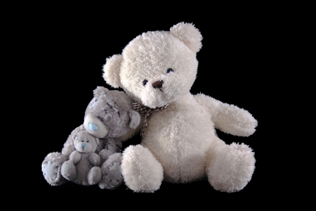 Teddy bear family with baby isolated on black backgroundの写真素材