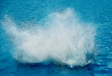 Water slashing throwing water in the air