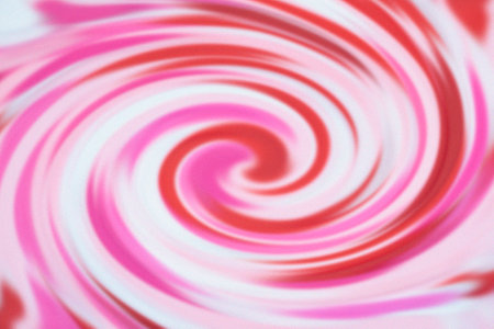Modern art glossy radial rippled curvy backdrop. Whirl gel fluid vivid pink eddy caramel syrup surfaceの写真素材
