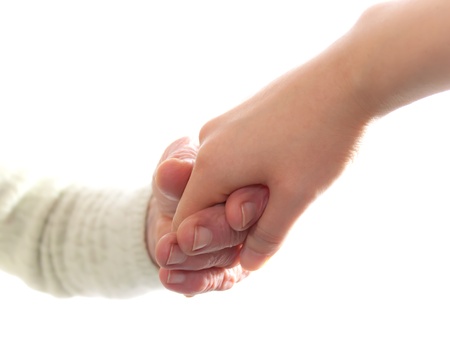 Senior and Young Women Holding Hands の写真素材