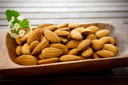 Almonds in wooden bowlの写真素材