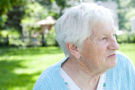 Senior lady in back yard in springの写真素材