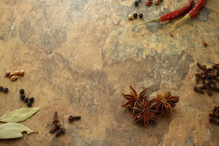 Collection on spices - star anise, cloves, chili peppers, laurel leave and corn peppersの写真素材