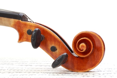 Violin Scroll on Sheet Musicの写真素材