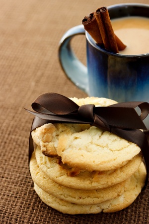 Cookies and coffee with cinnamon sticksの写真素材