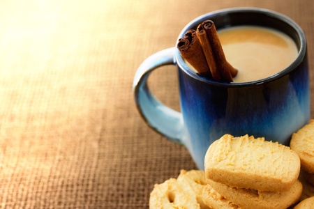 Cookies and coffee with cinnamon sticksの写真素材