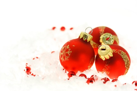 Red Christmas balls on snow flakesの写真素材