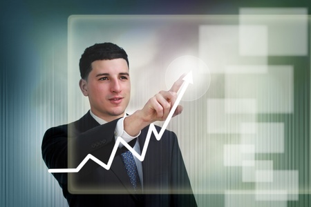 Businessman highlighting business growth on a graphの写真素材