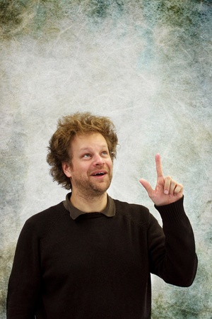 Man pointing upwardsの写真素材